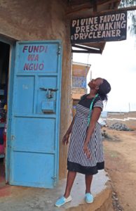 Ann excited at new shop sign, The Kenya Initiative